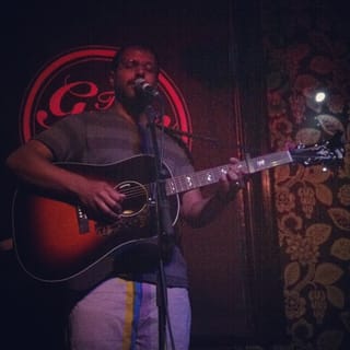 Bhi Bhiman performing live in 2013